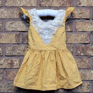 Yellow Dress with White Lace Detail